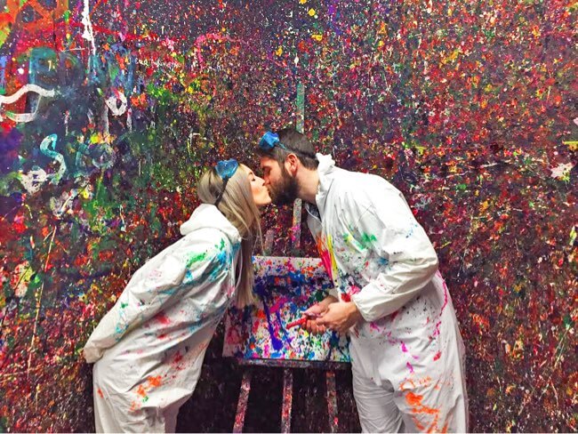 $99 includes 1 large or 2 small canvases with private Splatter Room? (up to $61 value); glow upgrade for two ($20 value), chocolates for two ($4 value), two glasses of champagne ($16 value) and private Splatter Room? ($14). Plan on about an hour for the experience to allow time to change into protective gear, clean up, and enjoy your champagne.