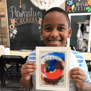 Boy with art camp project