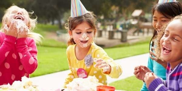 girls party cake on faces