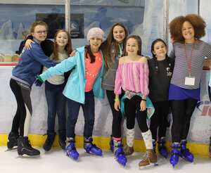 girls ice skating together