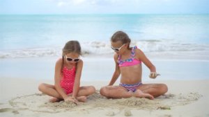 girls playing on beach