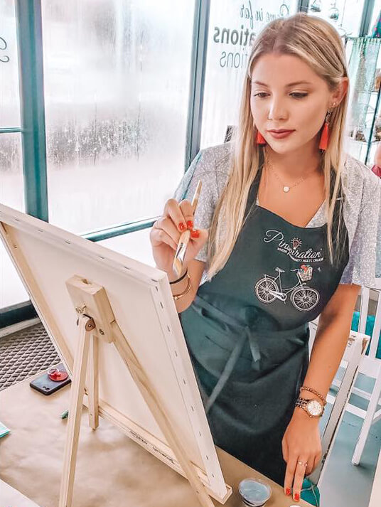 woman painting a canvas