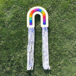 fiber art rainbow in grass