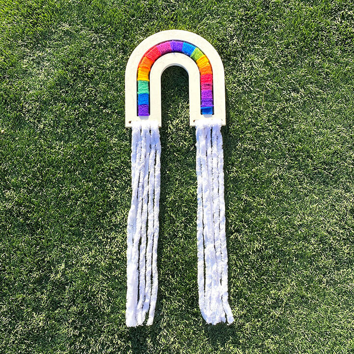 fiber art rainbow in grass